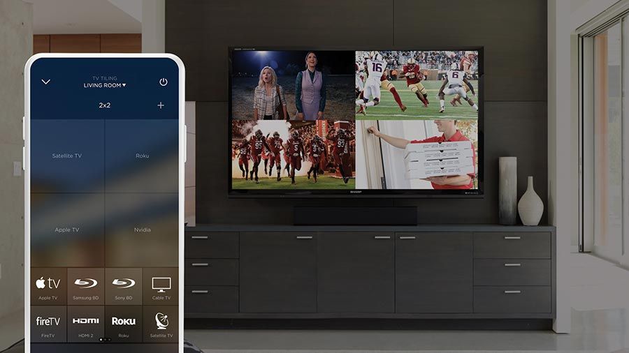 A smart TV displaying multiple screens, with a smartphone app interface controlling the home system.